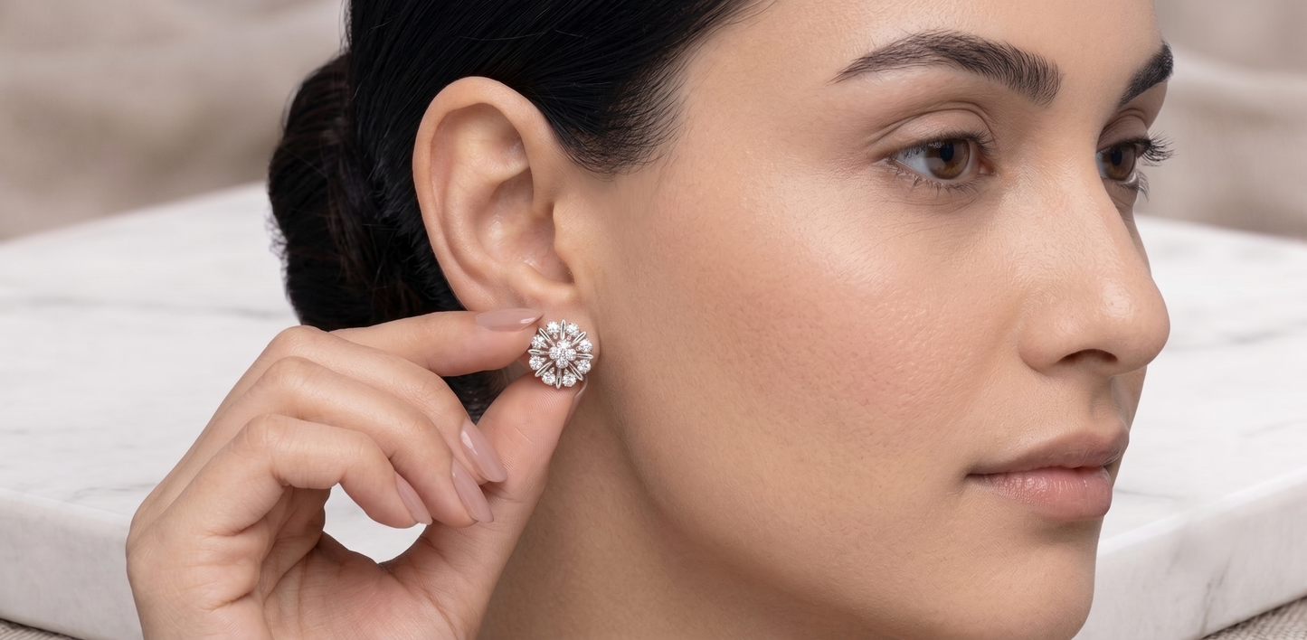 A pair of silver-toned flower-shaped stud earrings