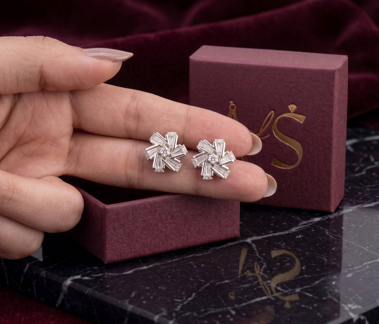 A pair of silver-tone geometric stud earrings