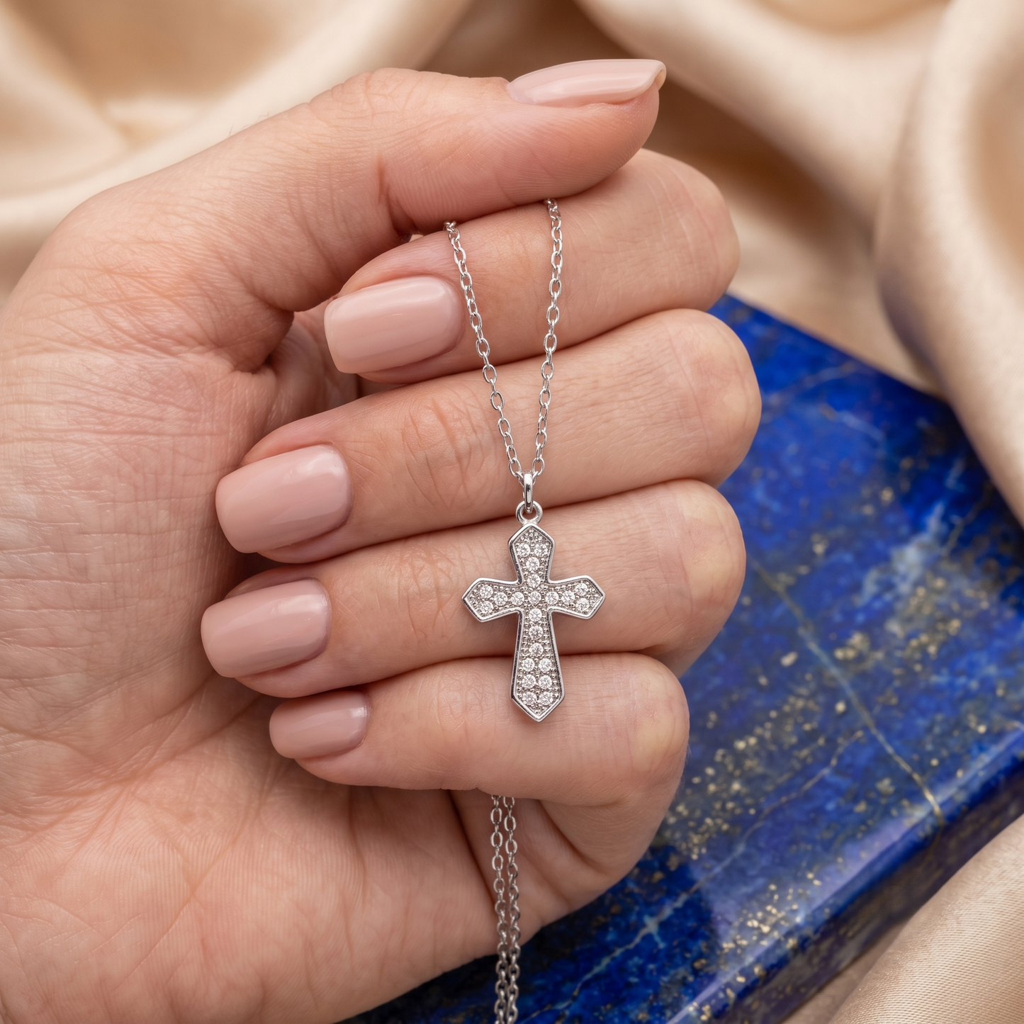 A silver cross pendant necklace