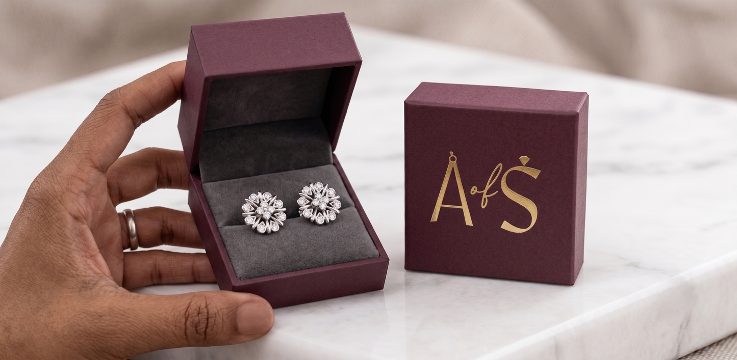 A pair of silver-toned flower-shaped stud earrings