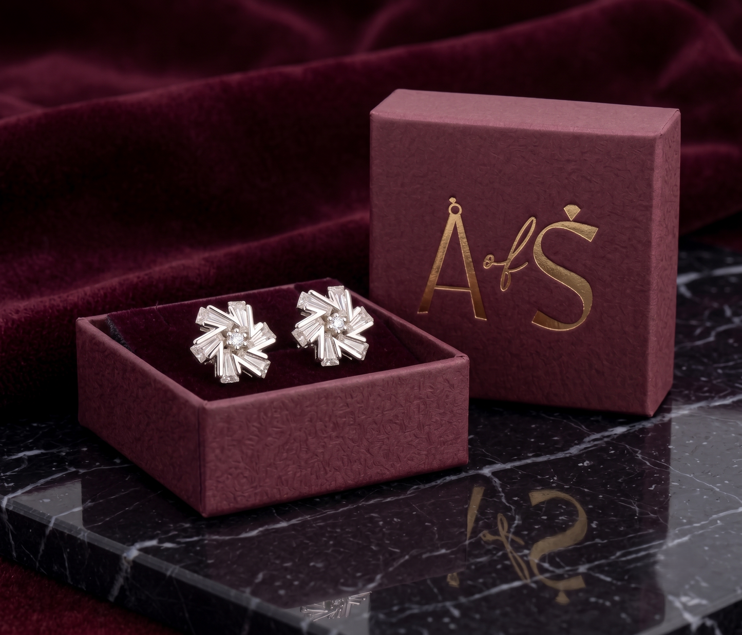 A pair of silver-tone geometric stud earrings