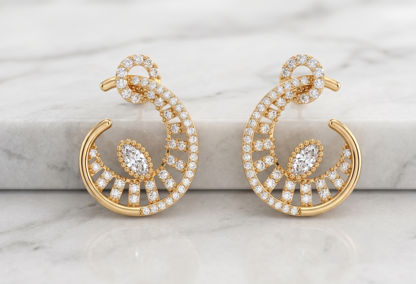 A pair of silver-toned crescent-shaped hoop earrings