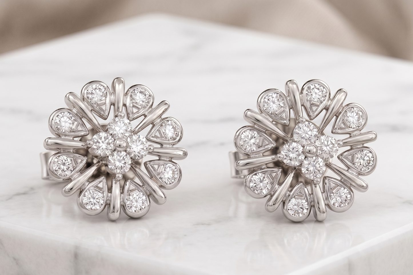 A pair of silver-toned flower-shaped stud earrings