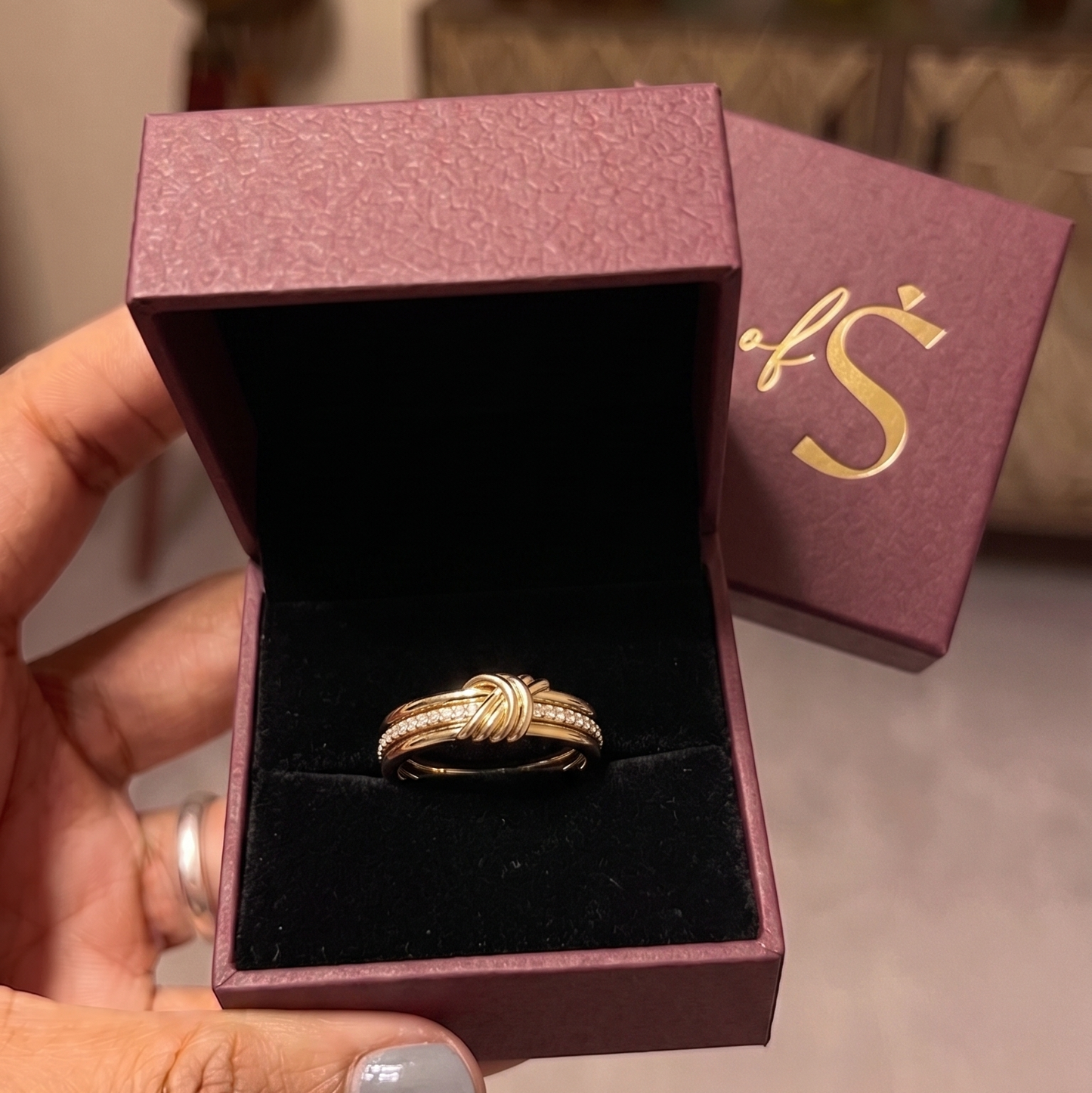A silver-toned triple-band ring