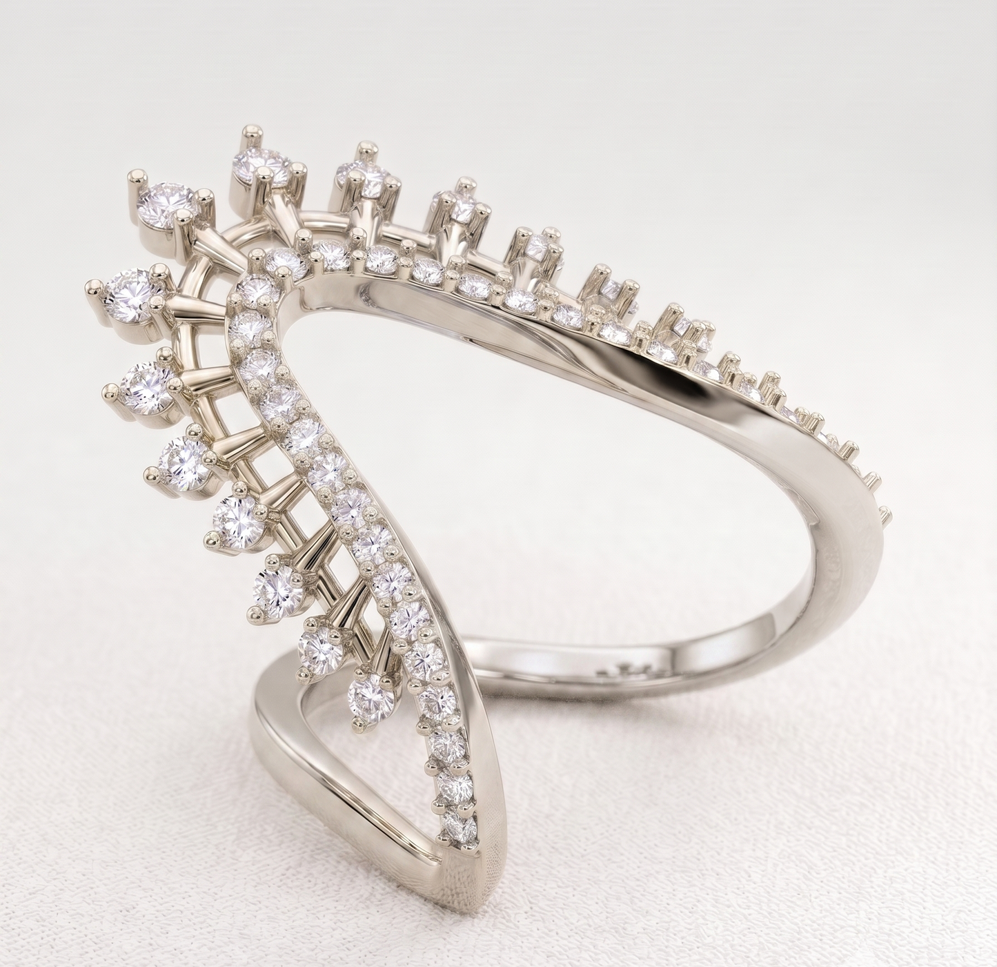 A silver-toned ring featuring a sweeping, open triangular design