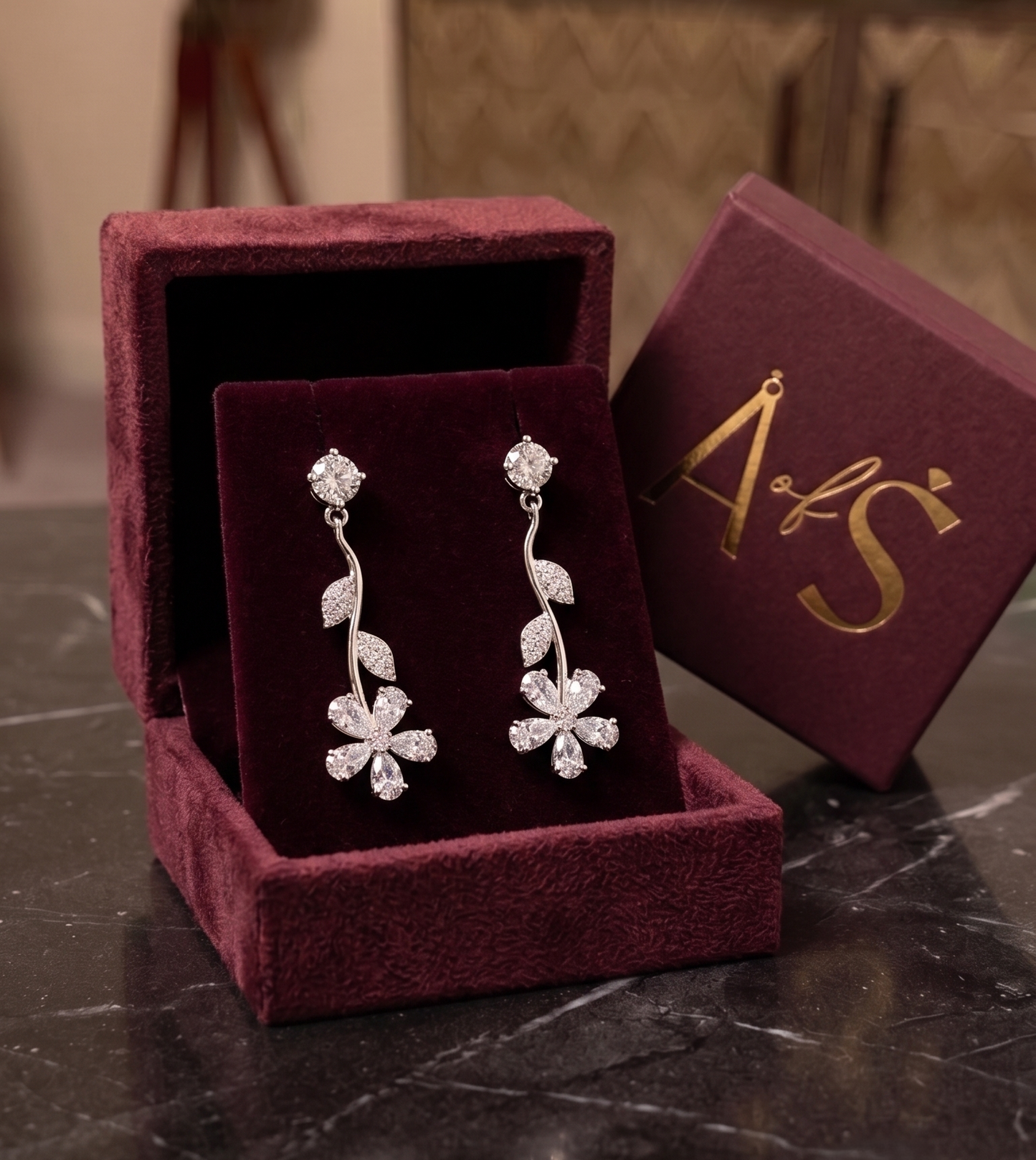 A pair of silver-toned dangle earrings