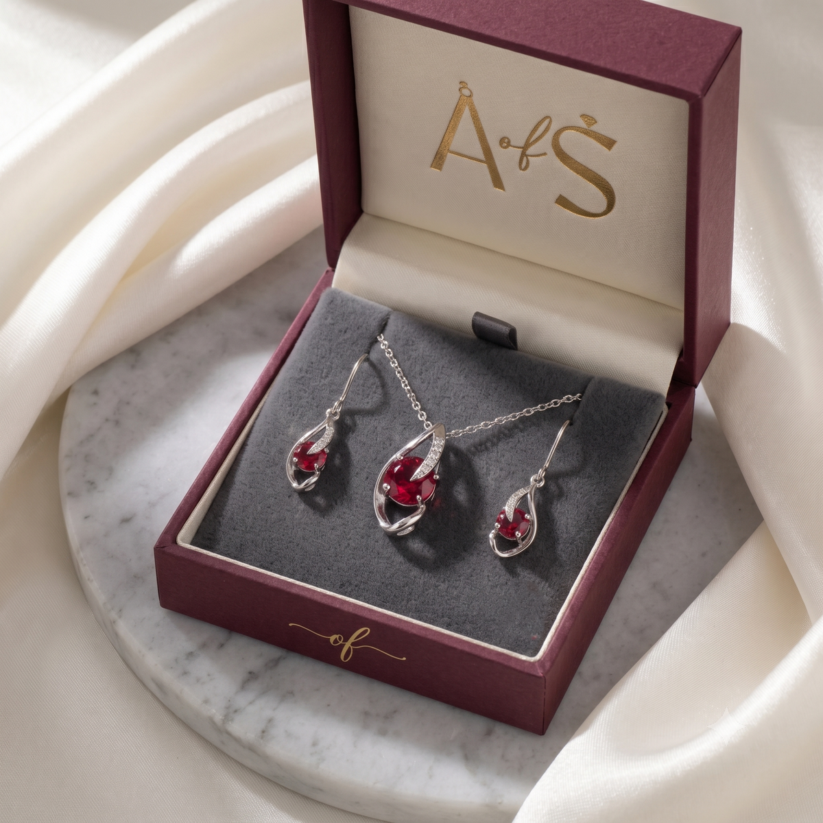 The Crimson Swirl Silver Pendant Set