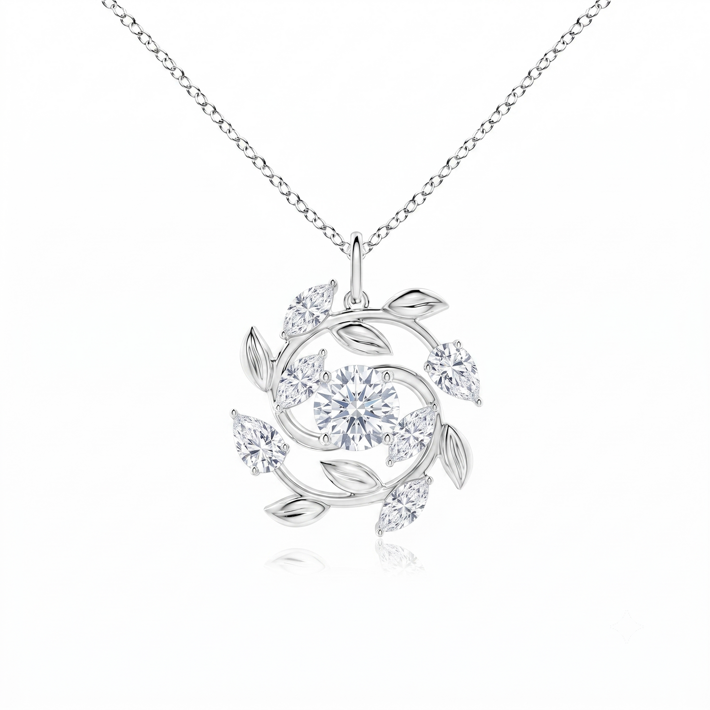 A silver-tone floral pendant necklace round stones leaf-like swirls,