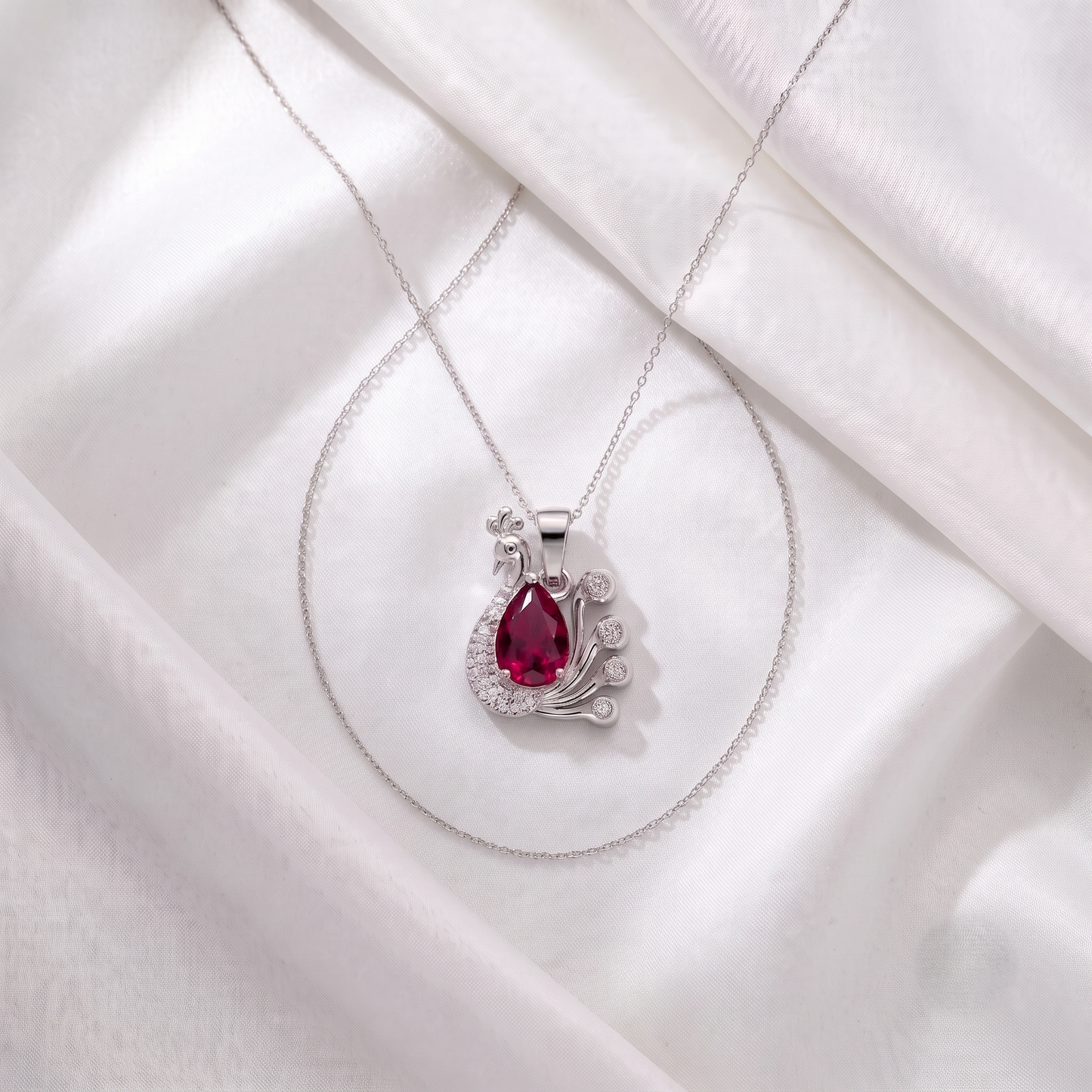 The Ruby Teardrop Peacock Silver Chain Pendant
