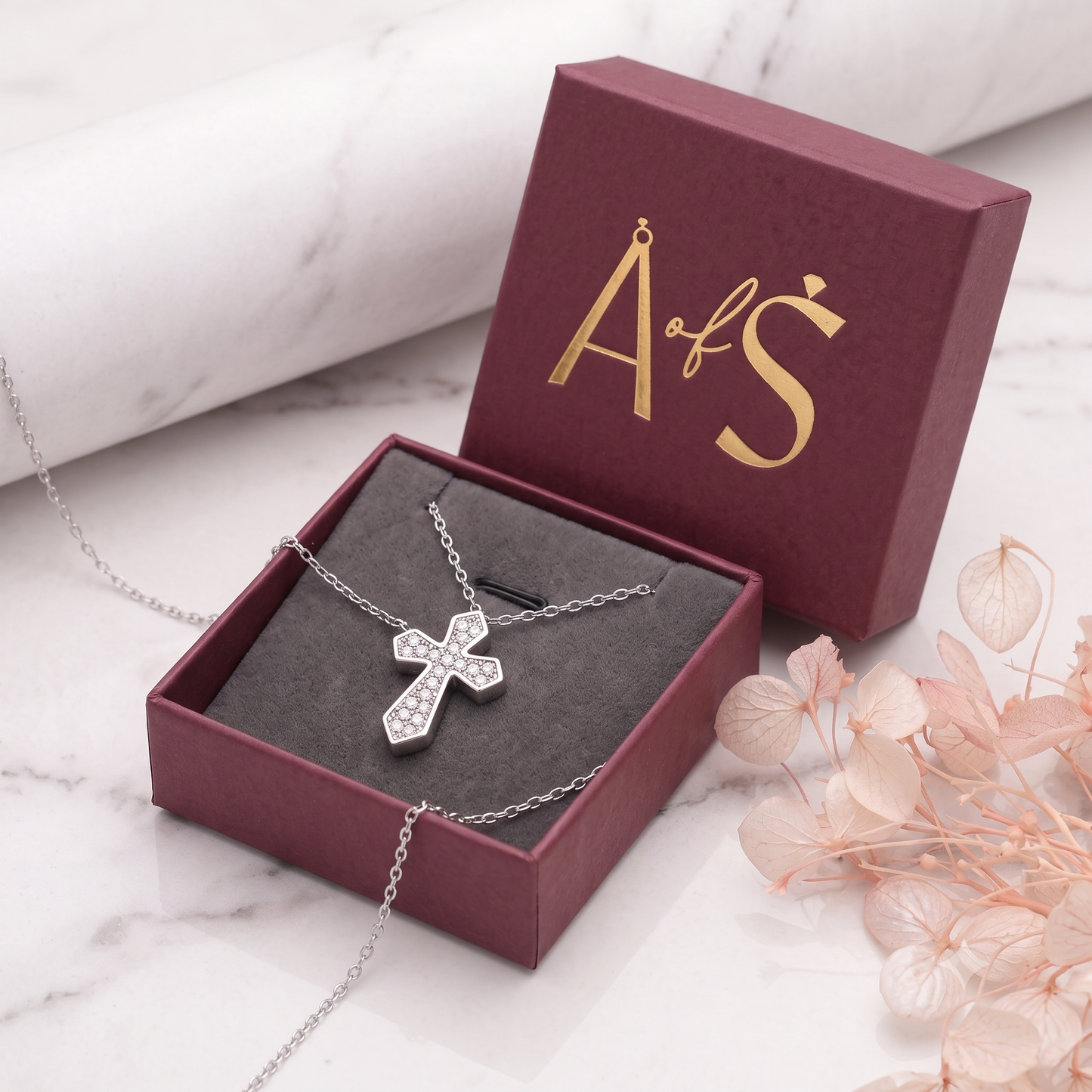 A silver cross pendant necklace