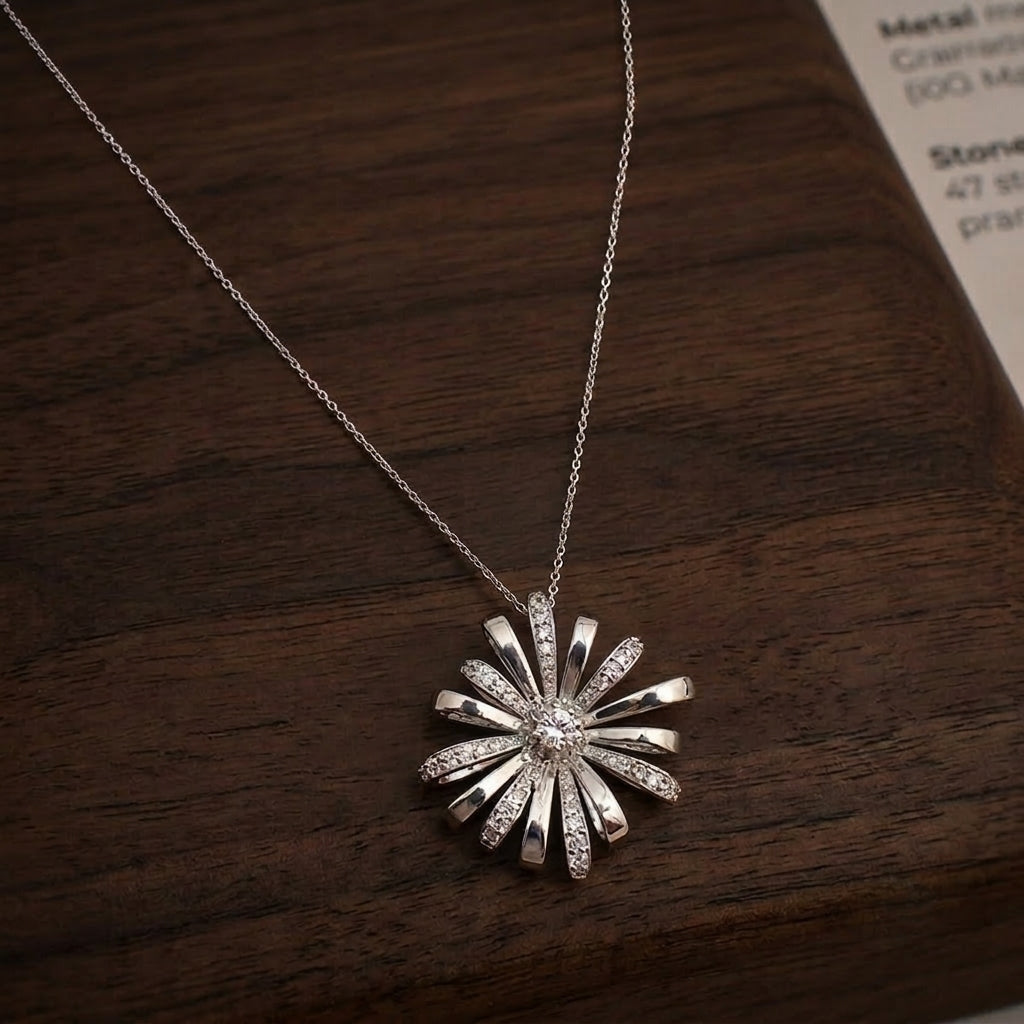 A silver sunburst chain pendant