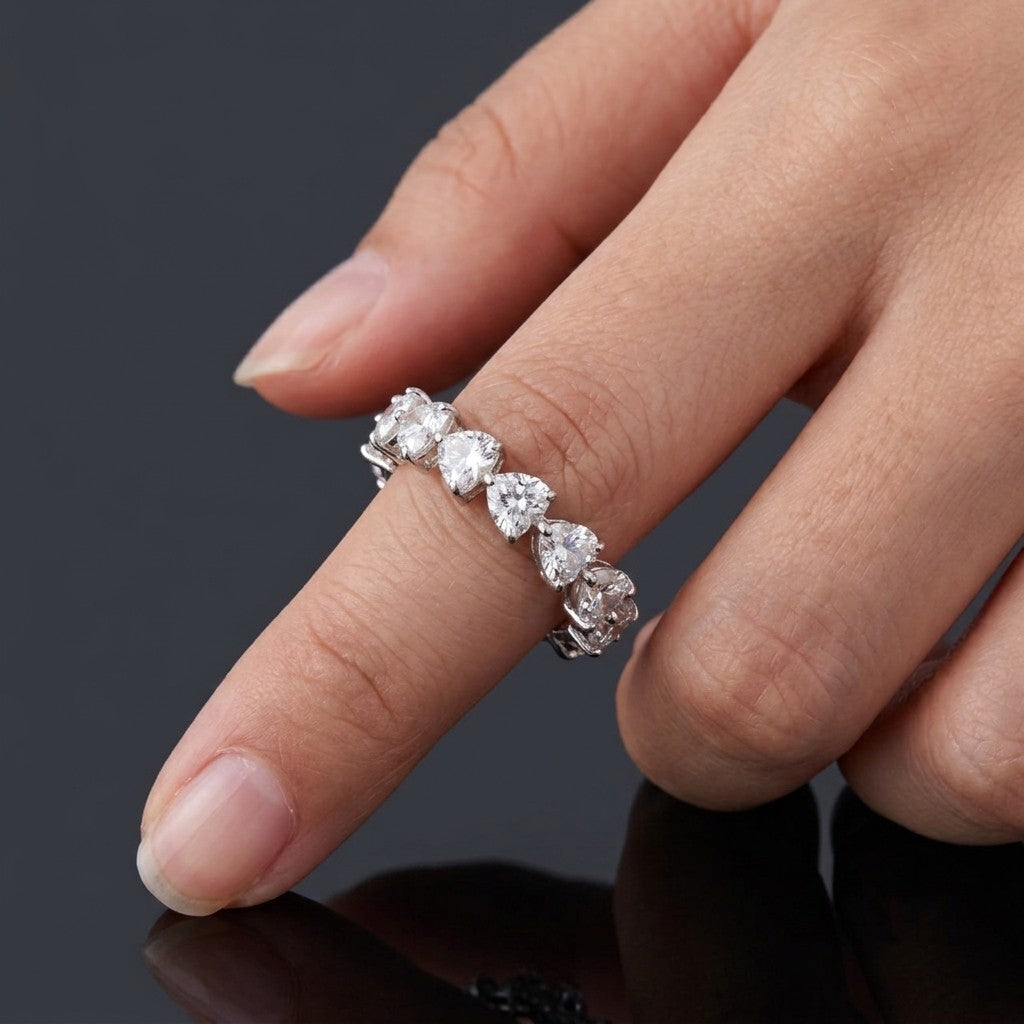 A silver-toned heart-link eternity band