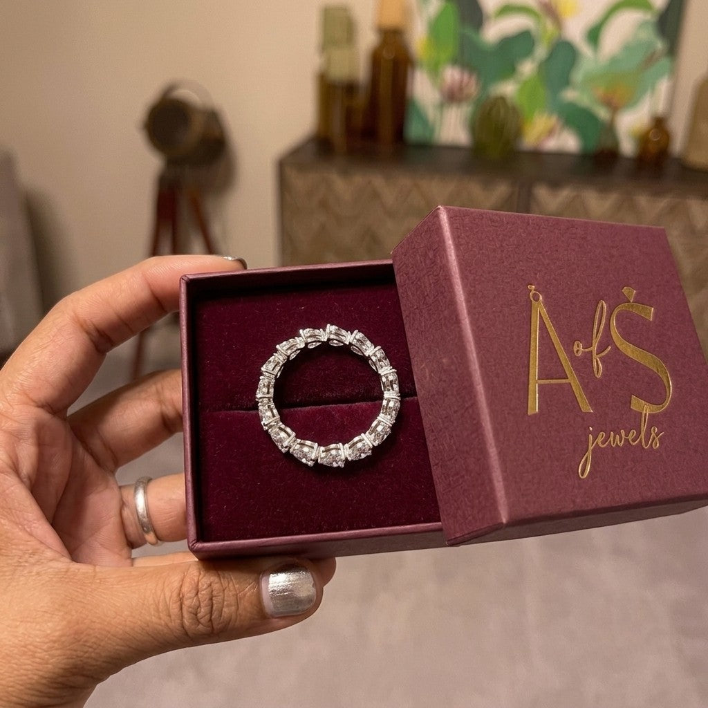 A silver-toned heart-link eternity band